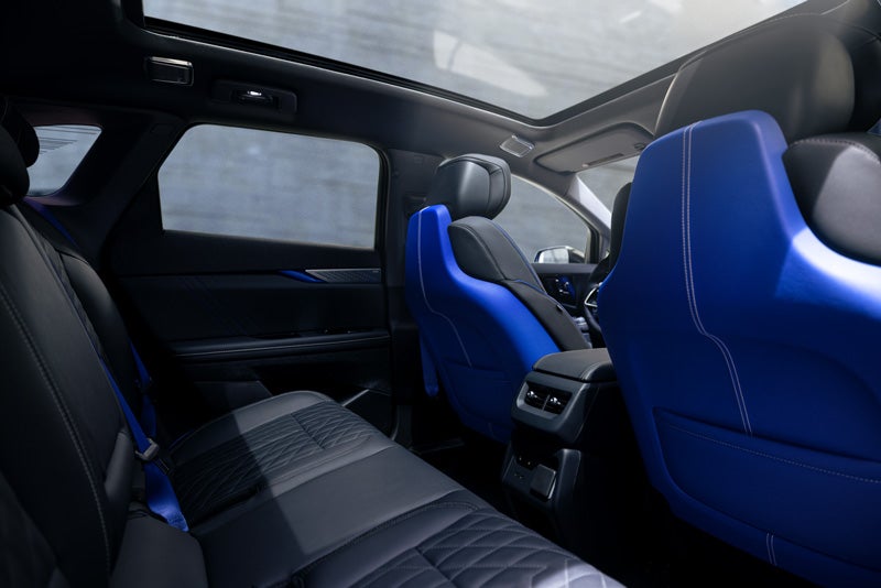 Back Seat View of the 2026 OPTIQ-V Blue Front Seats, Sun Roof, and Interior | Mataga Cadillac in Stockton CA
